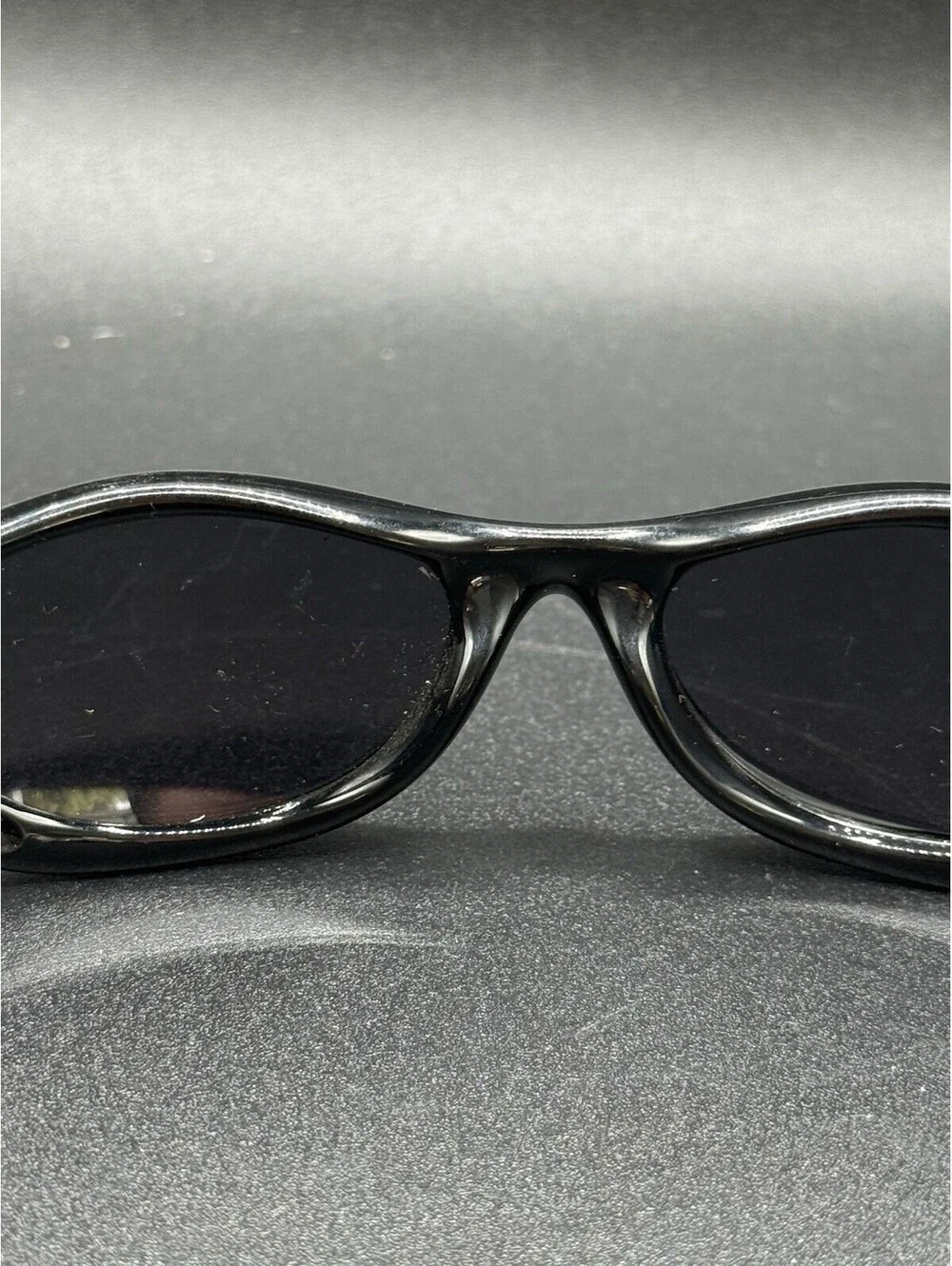 Oakley Pocket Polished Black/Black Iridium Lenses (Missing Right Arm)